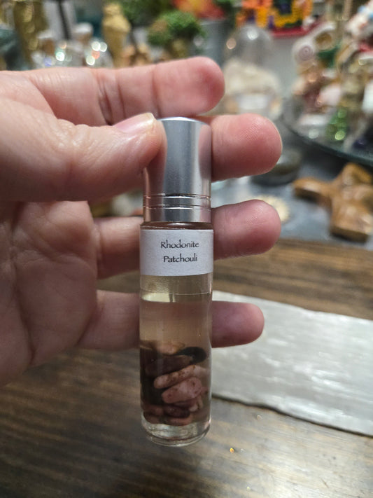 Love| lust| passion| Fertility |Prosperity | Spiritual growth| Grounding |Emotional Support | Heart Chakra| Self Love| Anxiety Relief| Rhodonite | Patchouli Crystal Essential Oil Roller