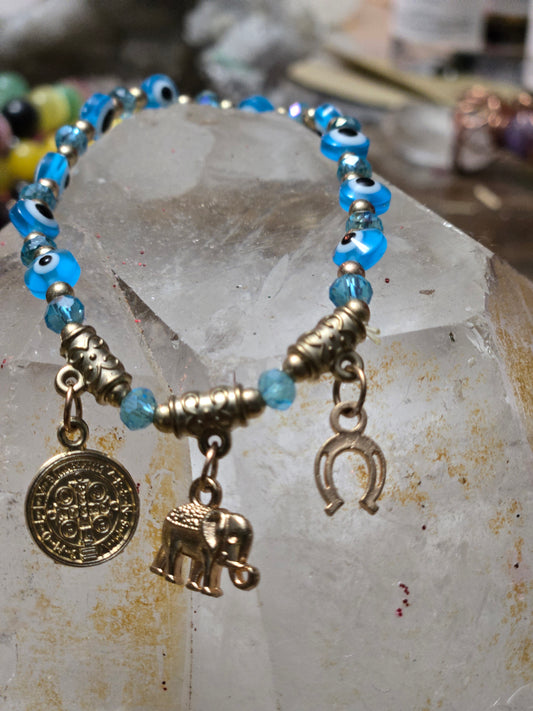Turquoise Evil Eye Protection Bracelet – St. Benedict • Elephant • Horseshoe Charms (Gold)